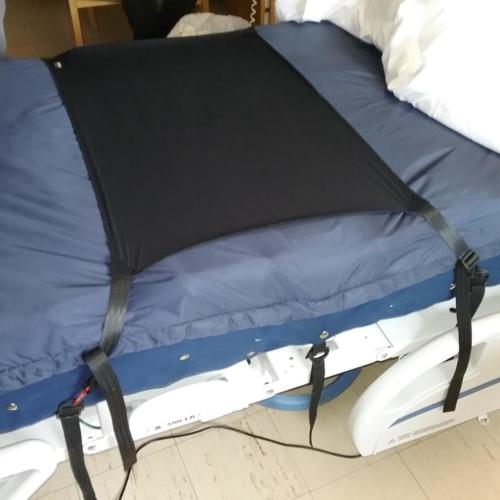 GlideWear 'under-sheet' for a specialty bed